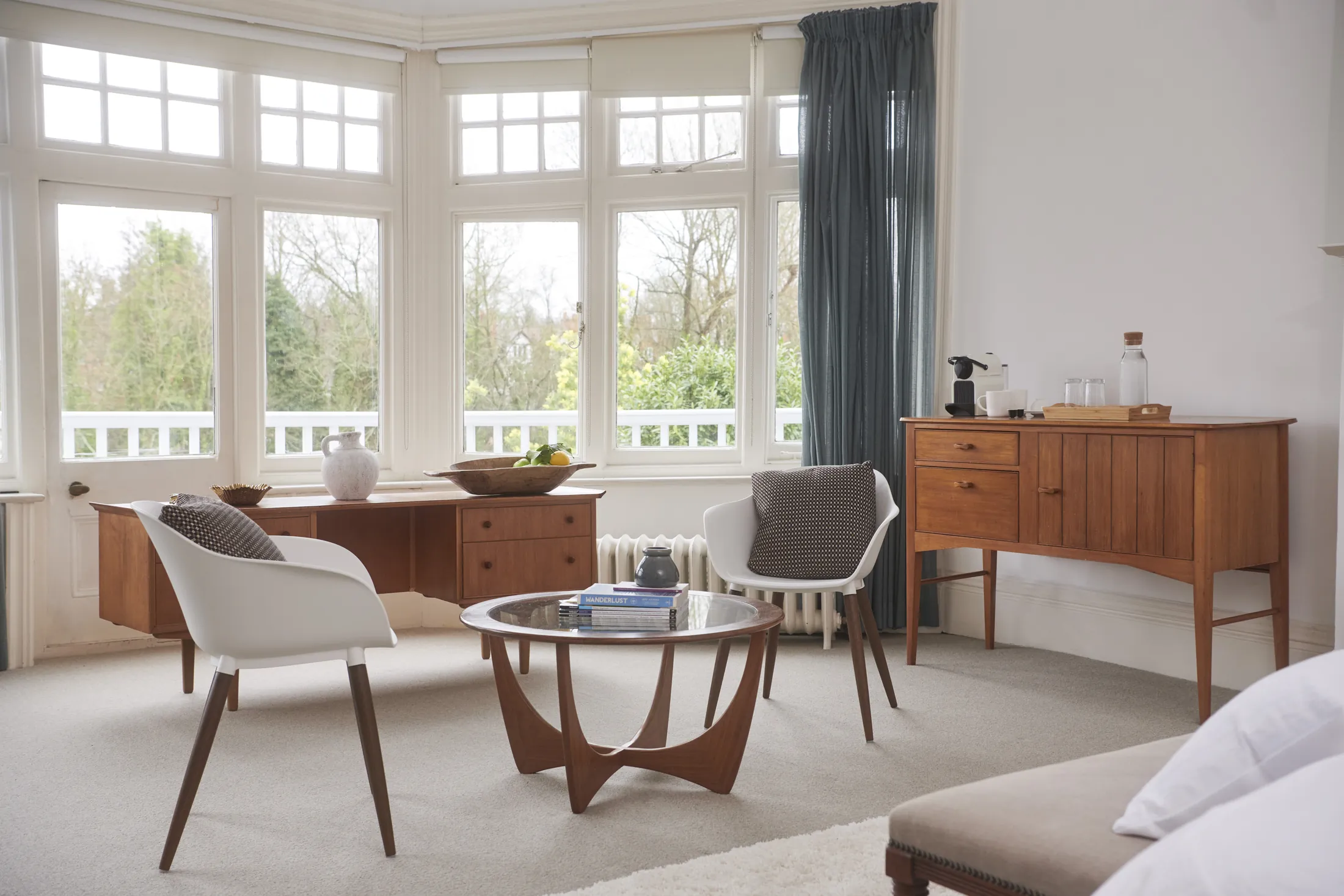 The bay windows of Guards Club, with a writing desk and armchairs facing the river